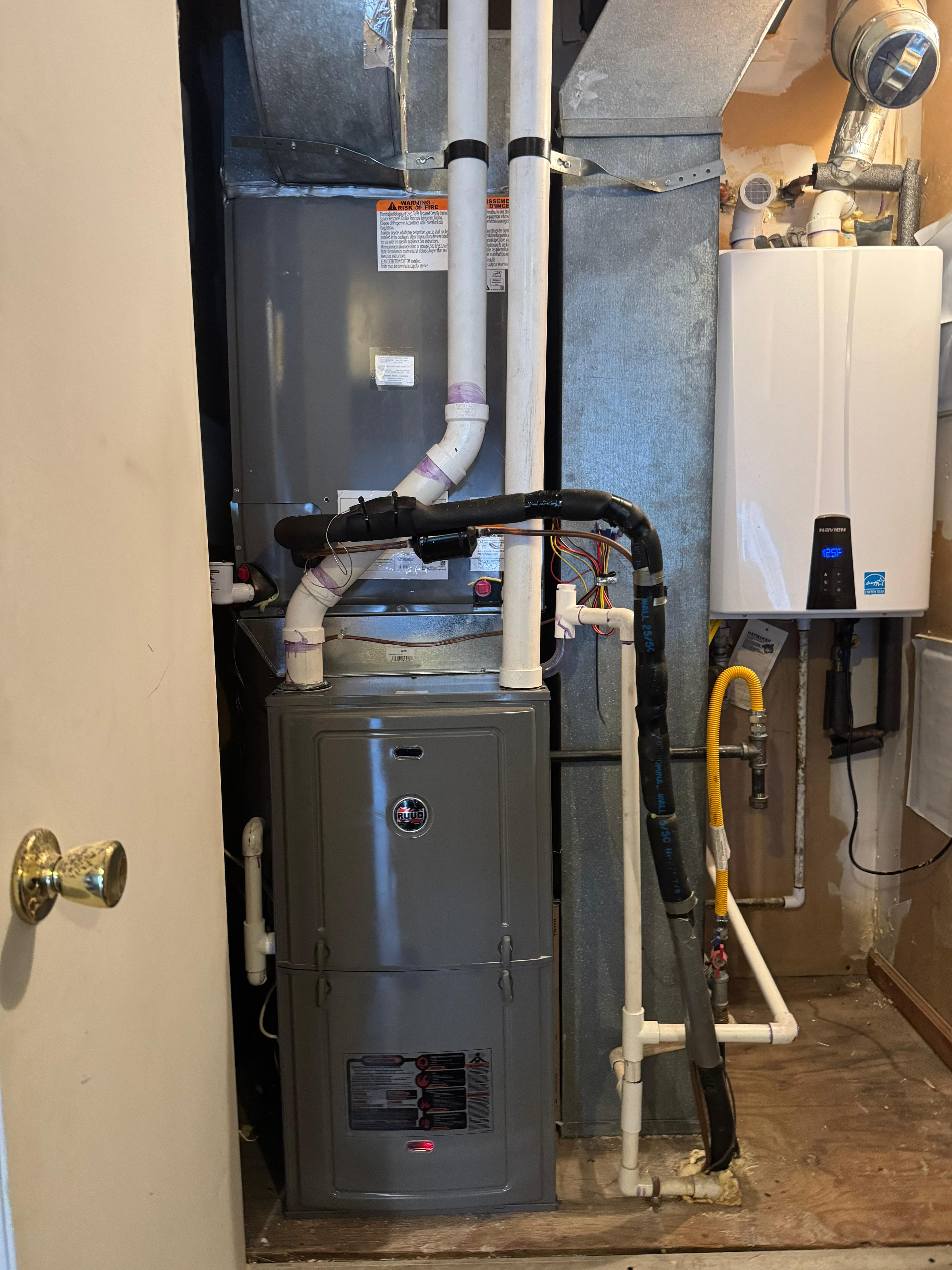 High-efficiency furnace install in a utility closet
